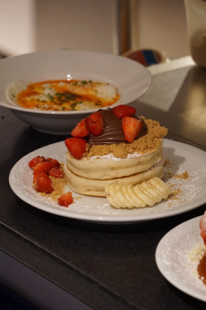 Pancakes with chocolate spread, strawberries and banana